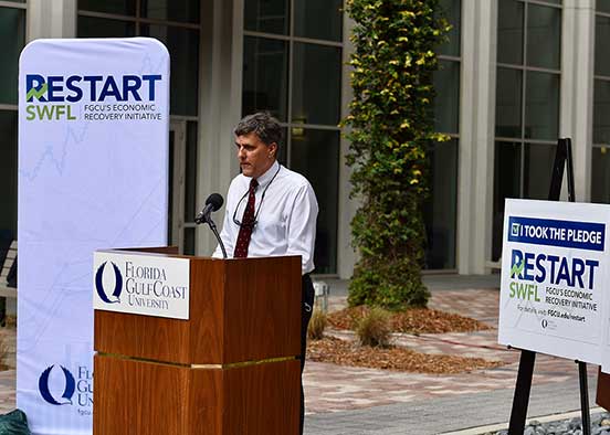 Photo shows FGCU dean