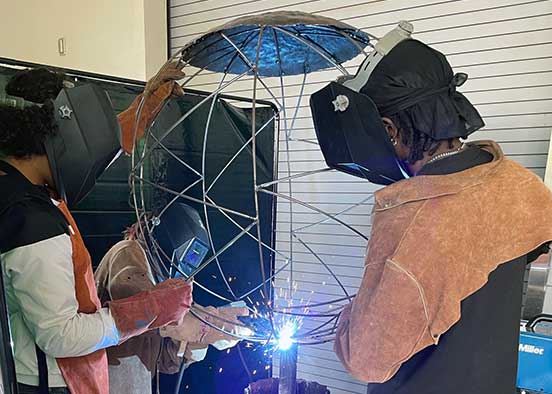 Students working on sculpture